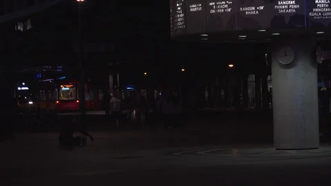 BERLIN, World clock and Alexanderplatz in night with tram and tourists. Stock Footage 78578132