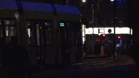 BERLIN, World clock and Alexanderplatz in night with tram and tourists. Stock Footage 78578393
