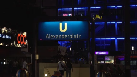 BERLIN, World clock and Alexanderplatz in night with tram and tourists. Stock Footage 78578566