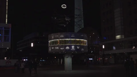 BERLIN, World clock and Alexanderplatz in night with tram and tourists. Stock Footage 78578826