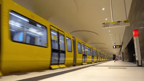 Berlin yellow subway train arriving at station Rotes Rathaus with doors opening Stock Footage 159664657