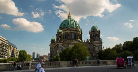 The Berliner Dom set against a bright blue sky, inviting tourists and locals to Stock Footage 314873565