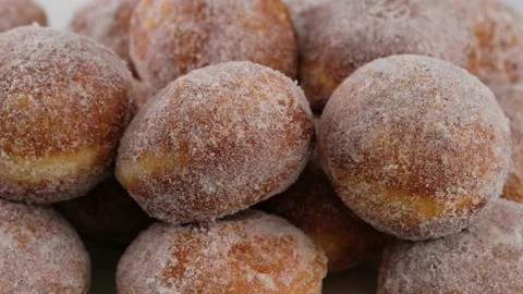 Berliners. Close-up camera movement. Sugar donuts are on a serving tray on a Stock Footage 152485569