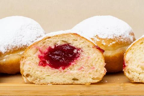 Berliners (German donuts) with raspberry jam Foto stock
