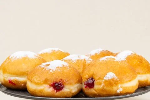 Berliners (German donuts) with raspberry jam Foto stock