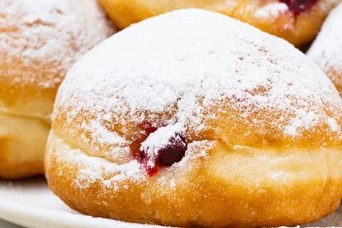 Berliners (German donuts) with raspberry jam Foto stock