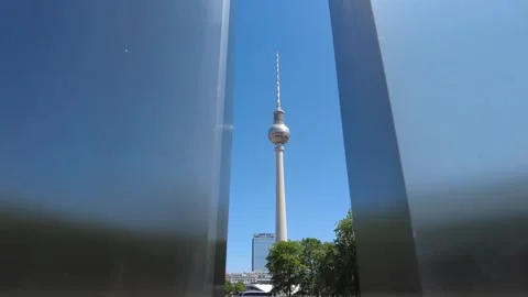 Berlin's Television Tower behind an artistic structure Stock Footage 282190043