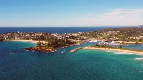 Bermagui town with river entering Pacific ocean in aerial landscape as 4k. Stock Footage 183102754