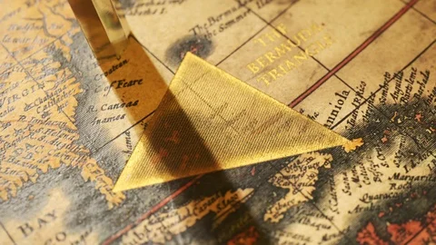 Bermuda triangle marked with golden ink on a vintage map. Compass malfunction. Stock Footage 110110135