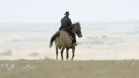 Bernard Warkentin riding on horseback while searching land to plant wheat, 1870s Stock Footage 202537556