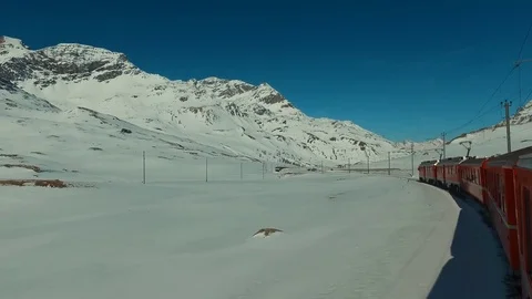Bernina Express ascends to the Bernina Pass, glacier and Piz Bernina 스톡 동영상 74063406