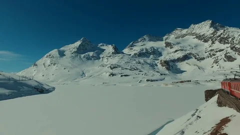 Bernina Express ascends to the Bernina Pass, glacier and Piz Bernina 스톡 동영상 74063407