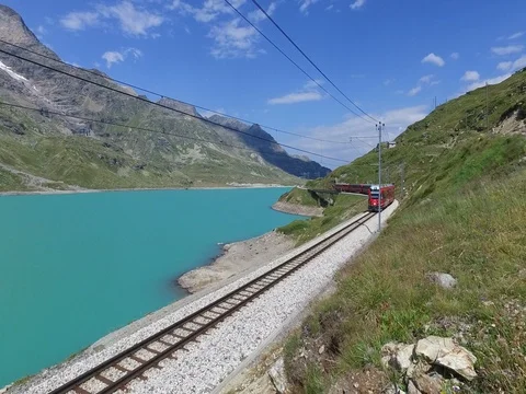 Bernina Express - Red train on Bernina Lake Stock Footage 78344026
