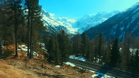 Bernina Express red train descends from the Bernina Pass, glacier, Piz Bernina 스톡 동영상 74063455