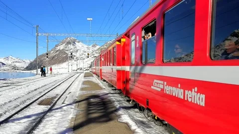 Bernina Express - Train station and passengers Stock Footage 71090606