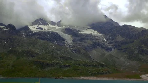 Bernina Glacier Timelapse With Breaking Clouds Stock Footage 331921537