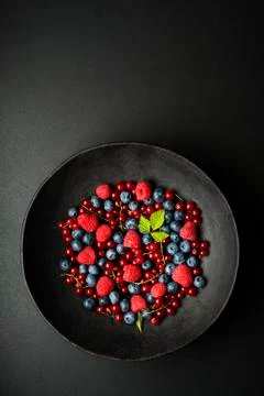 Berries on black table Foto stock
