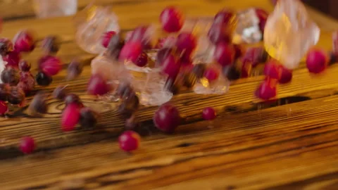 Berries fall on the table, cherries and ice. Stock Footage 146127342