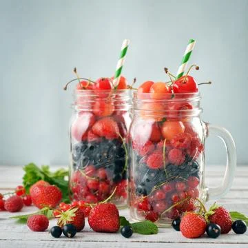 Berries in  jar with handle Stock Photos