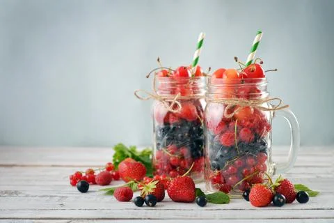 Berries in  jar with handle Stock Photos