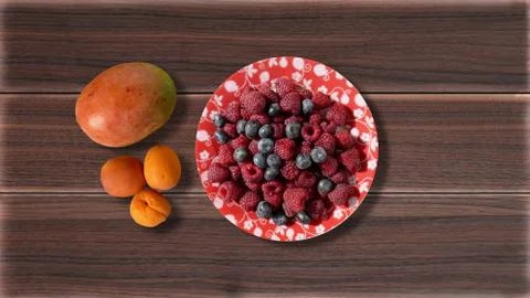 Berries in a plate on a table Stock Photos
