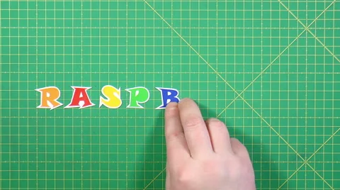 Berries raspberry beying spelled out on the green background Stock Footage 48924863