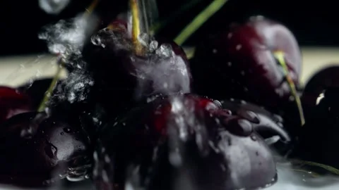 Berries of ripe cherries with branches are watered with a stream of water o.. Stock Footage 296651817