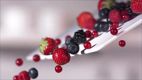 Berries Rolling Down a Cutting Board in Slow Motion. Stock Footage 246478203
