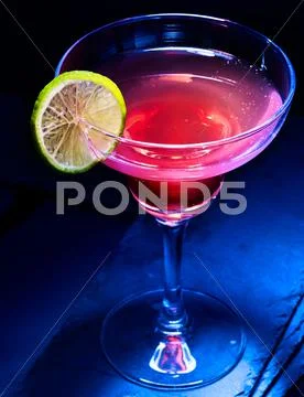 Berry alcohol cocktail on black background. Stock Photos