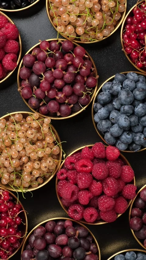 Berry Bowls On Dark Background Vertical Video 스톡 동영상 345086982