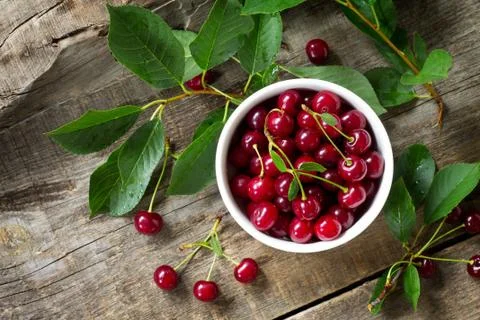 Berry Cherry on a wooden table rustic. Natural detox, fruit dessert. Stock Photos