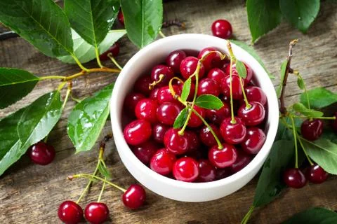 Berry Cherry on a wooden table rustic. Natural detox, fruit dessert. Stock Photos