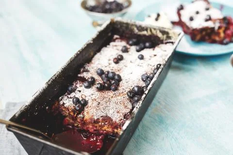Berry crumble in the baking-Tin on the table Stock Photos