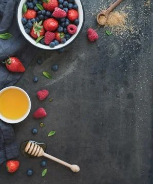 Berry frame with copy space on right. Strawberries, raspberries, blueberries  Stock Photos