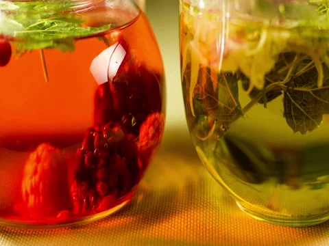 Berry herbal tea brewing process in cup, teapot. Healthy drinks. Time lapse. 4K Stock Footage 73395047