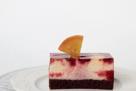 Berry Mousse Cake Slice topped with Candied Orange Wedge Stock Photos
