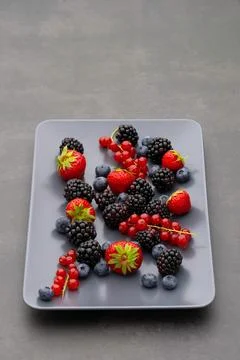 Berry pattern, collection of fresh forest berries on table , top view Stock Photos