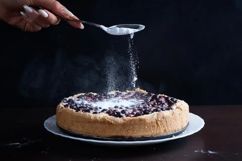 Berry pie cake from the cherries currants in a bowl fresh steaming hot sprinkle Stock Photos