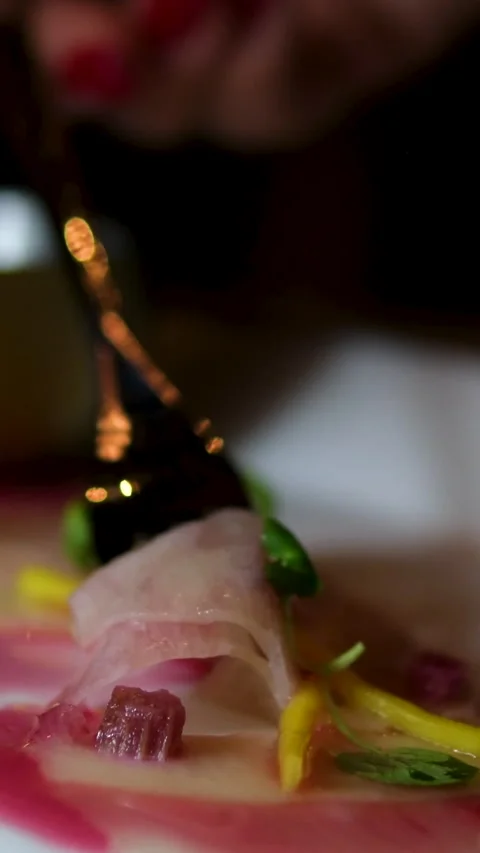Berry red sauce raw fish carpaccio Woman holds tuna carpaccio slice on a fork Stock Footage 302805003