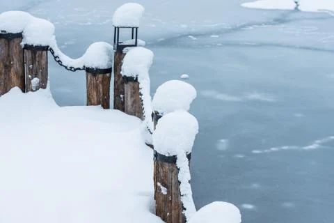 Berth with a chain in the snow Photos