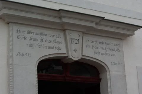 Berthelsdorf, Saxony/Germany - June 16th 2018. Bible text above the entrance Stock Photos