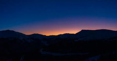 Berthoud Pass mountain range silhouette sunset in Winter Colorado Stock Photos