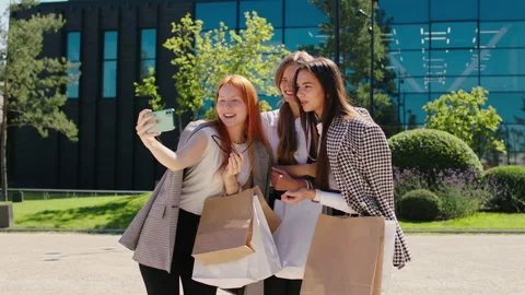 Beside of shopping centre smiling large group of charismatic ladies after a good Stock Footage 164872334
