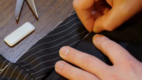 Bespoke tailoring artisan tradition : Sewing a  tailored black jacket suit. Stock Footage 127479775