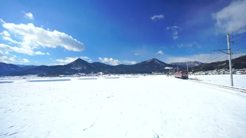 Bessho Line's Sanada Dream Train, Snowfield, and Mount Fudami Stock-Footage 330743998