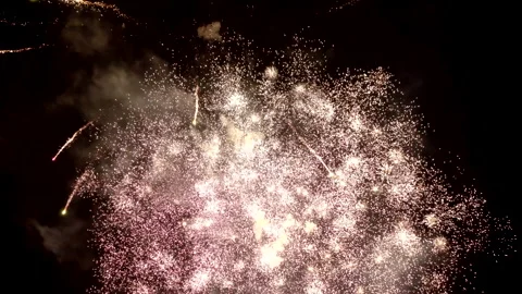 Best amazing beautiful color exploding fireworks a background night sky. 4K. Stock Footage 295886628