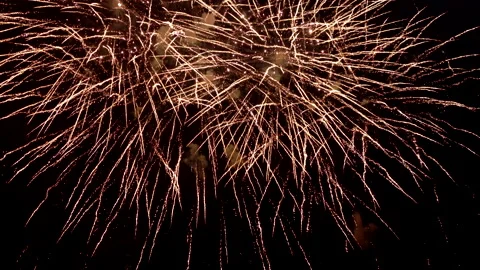 Best amazing beautiful color exploding fireworks a background night sky. 4K. Stock Footage 295887557