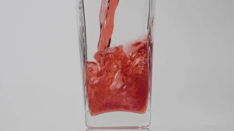 Best beverage. Super slow motion shot of pouring pomegranate juice into a Stock Footage 147414079