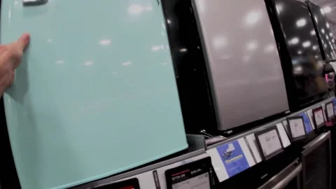 Best Buy electronics retail store interior hand opening a small fridge Stock Footage 227366240