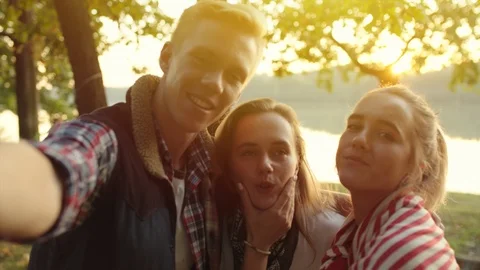 Best friends are making self portrait at sunset Stock Footage 98680841